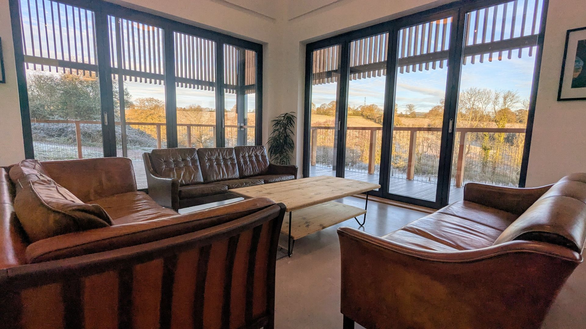 The venue lounge with leather sofas and large windows