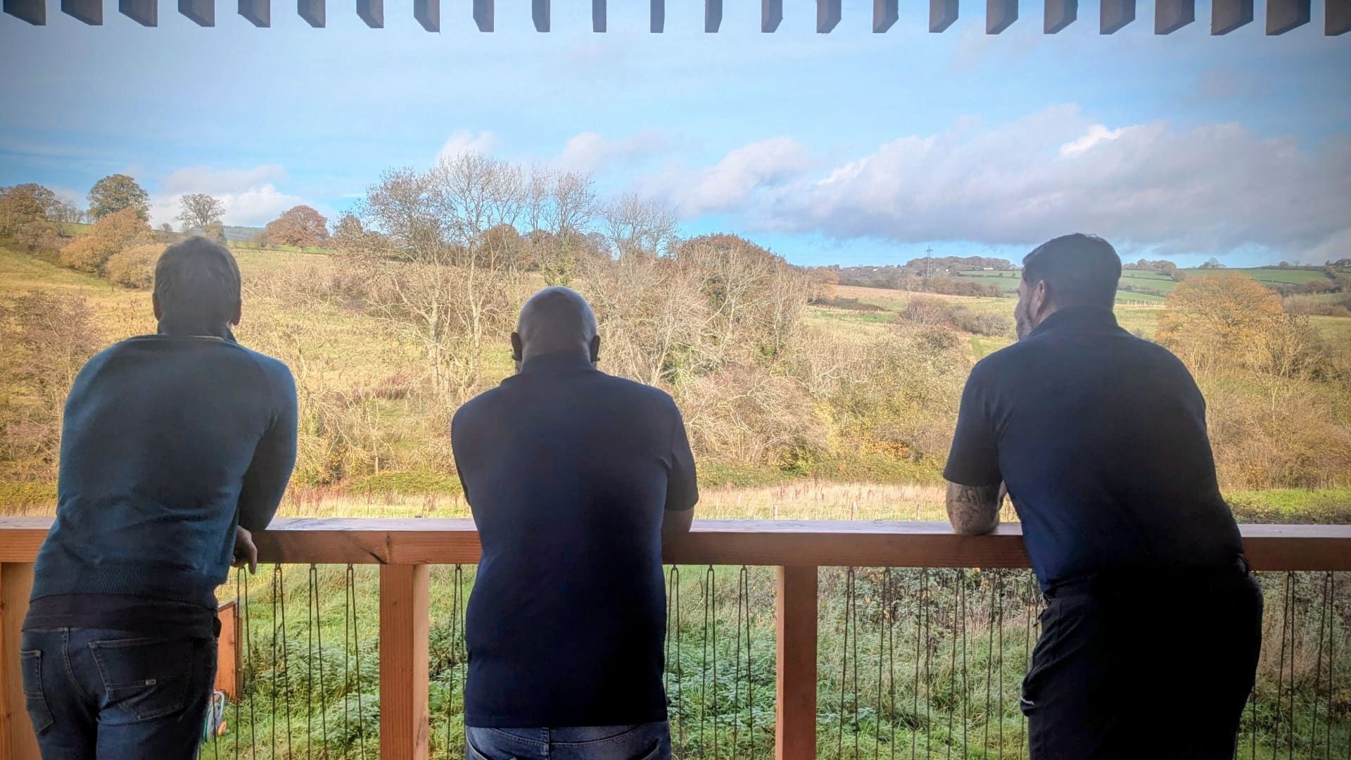A team taking in the view from the Grange Project balcony