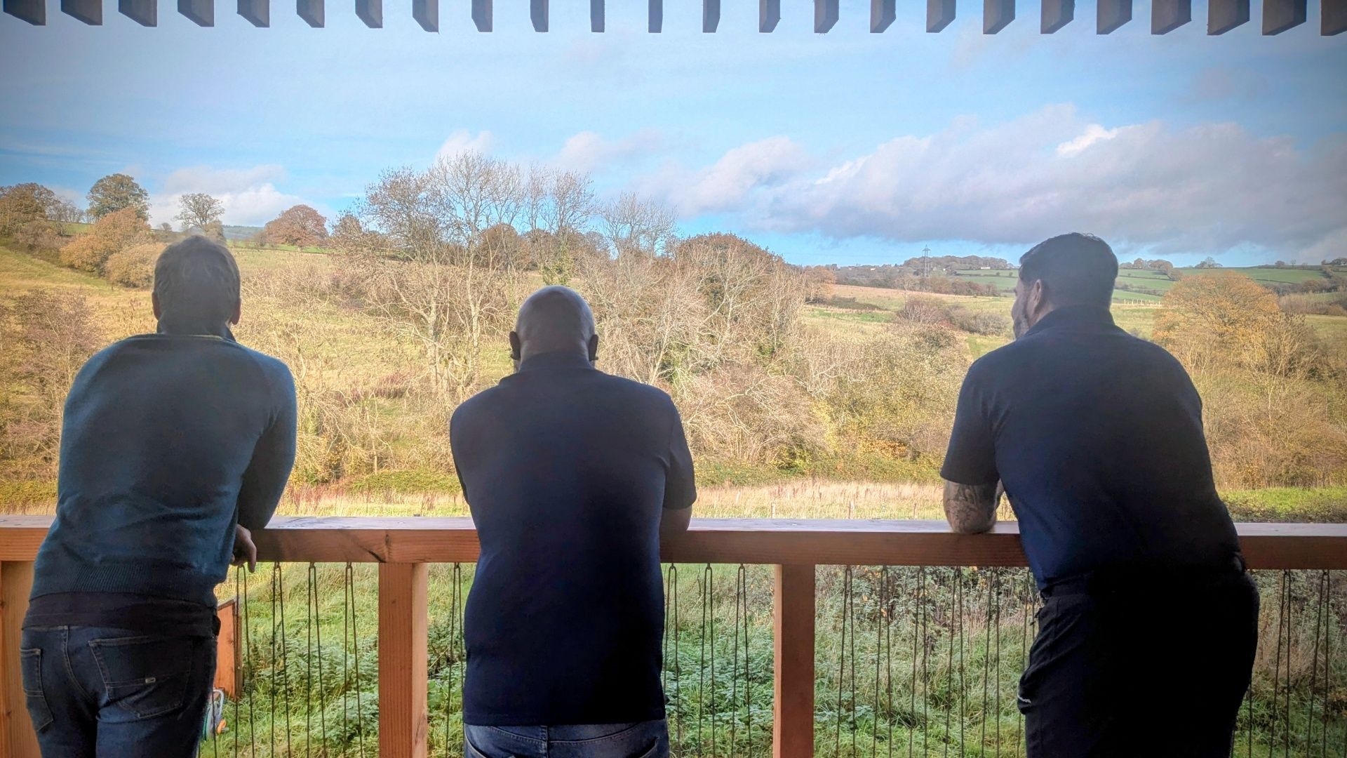 A team taking in the view from the Grange Project balcony