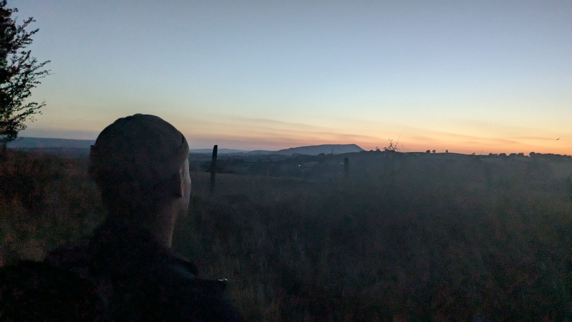 Team bonding beneath the evening sky at the Grange Project
