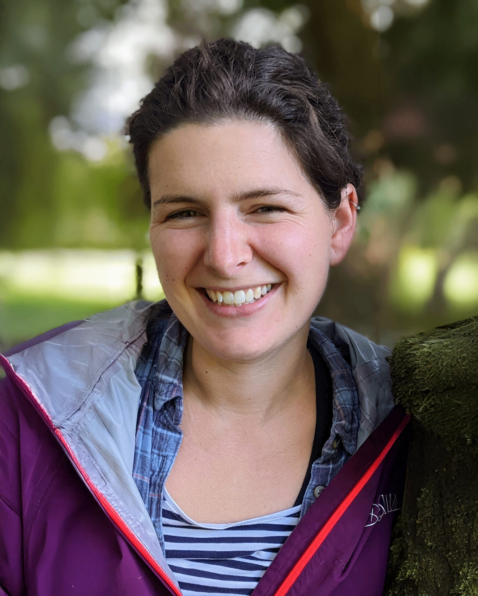 Dr. Chloe Constable, founder and lead facilitator, smiling outdoors in natural setting